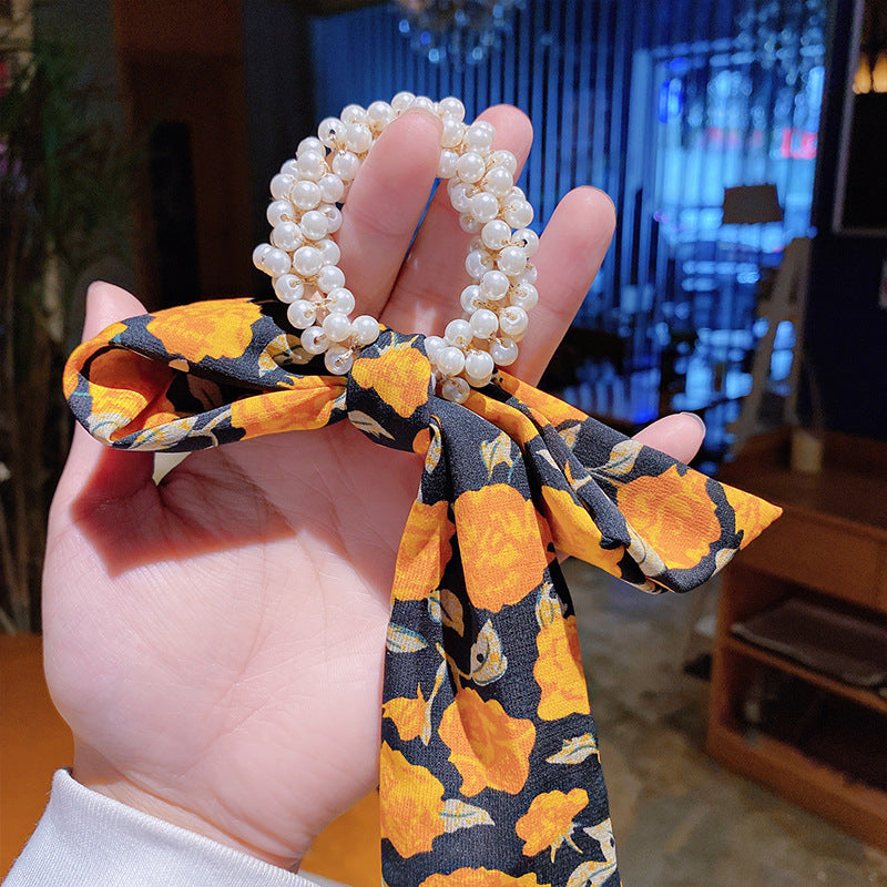 Elegantes Haarband mit Perlen & Blumen-Schleife