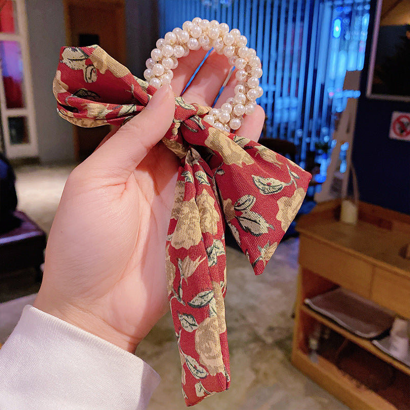 Elegantes Haarband mit Perlen & Blumen-Schleife