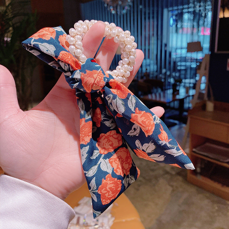 Elegantes Haarband mit Perlen & Blumen-Schleife